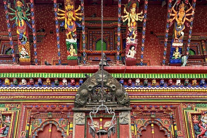 Private Kathmandu Day Tour - UNESCO World Heritage Sites - Swayambhunath Monkey Temple: prayer wheels and Buddha looking west